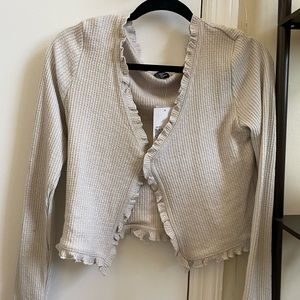 Knit ruffle-hem cardigan top